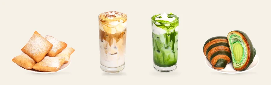 Bánh beignet, cà phê kem, ly Matcha Einspanner phủ kem tươi đánh bông và sốt matcha, cùng croissant nhân kem trứng vị bơ xếp thành hàng.